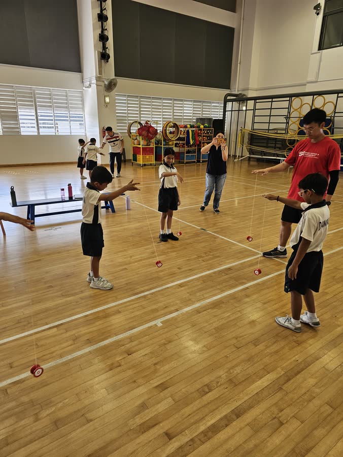Children practicing yoyo after school