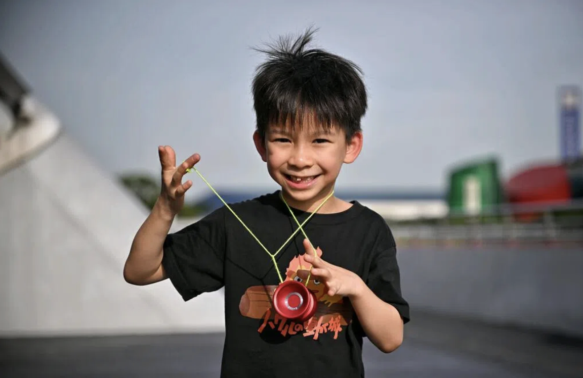 Boy learning yo-yo