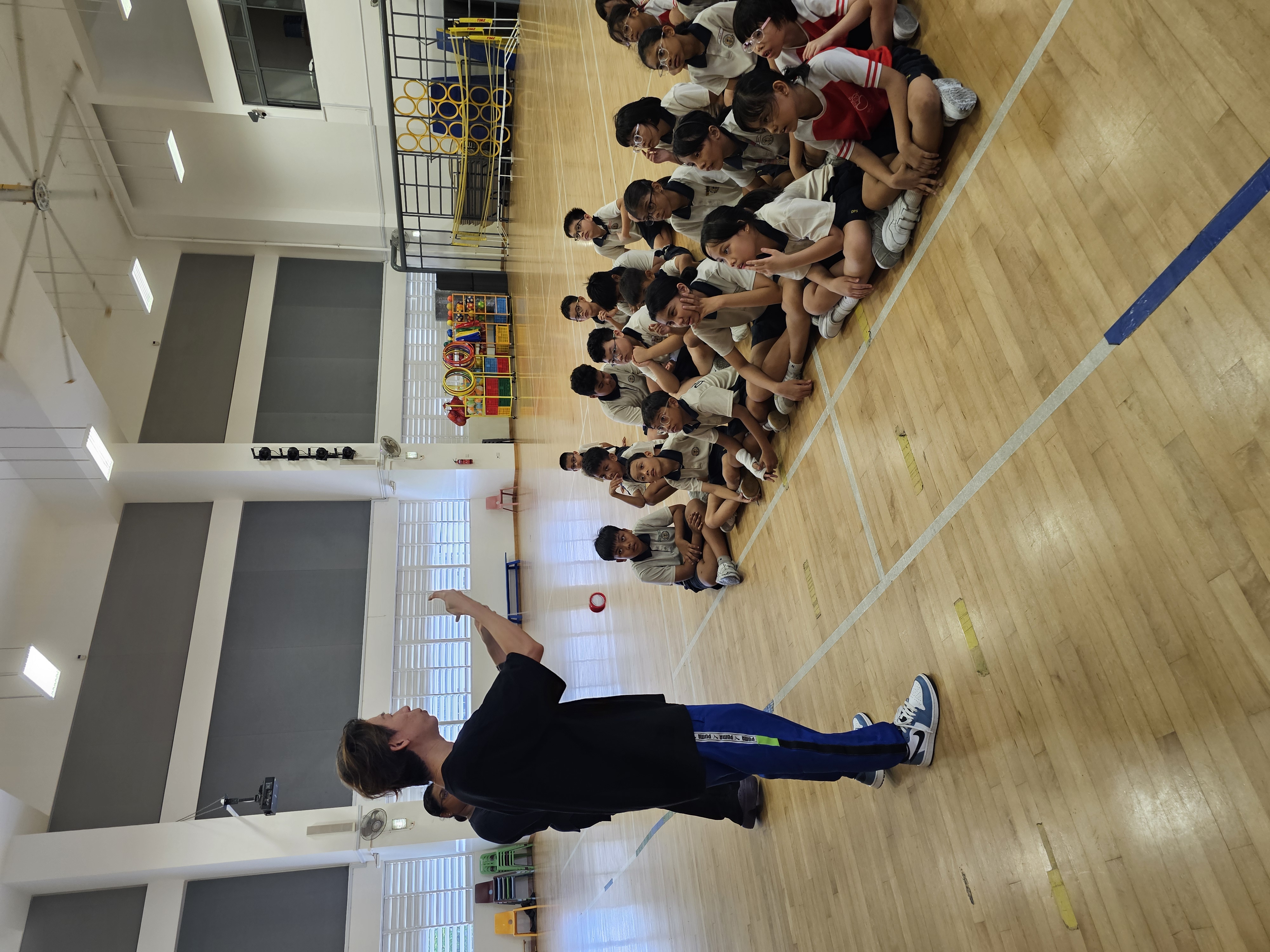 Students learning yoyo tricks in MOE school program