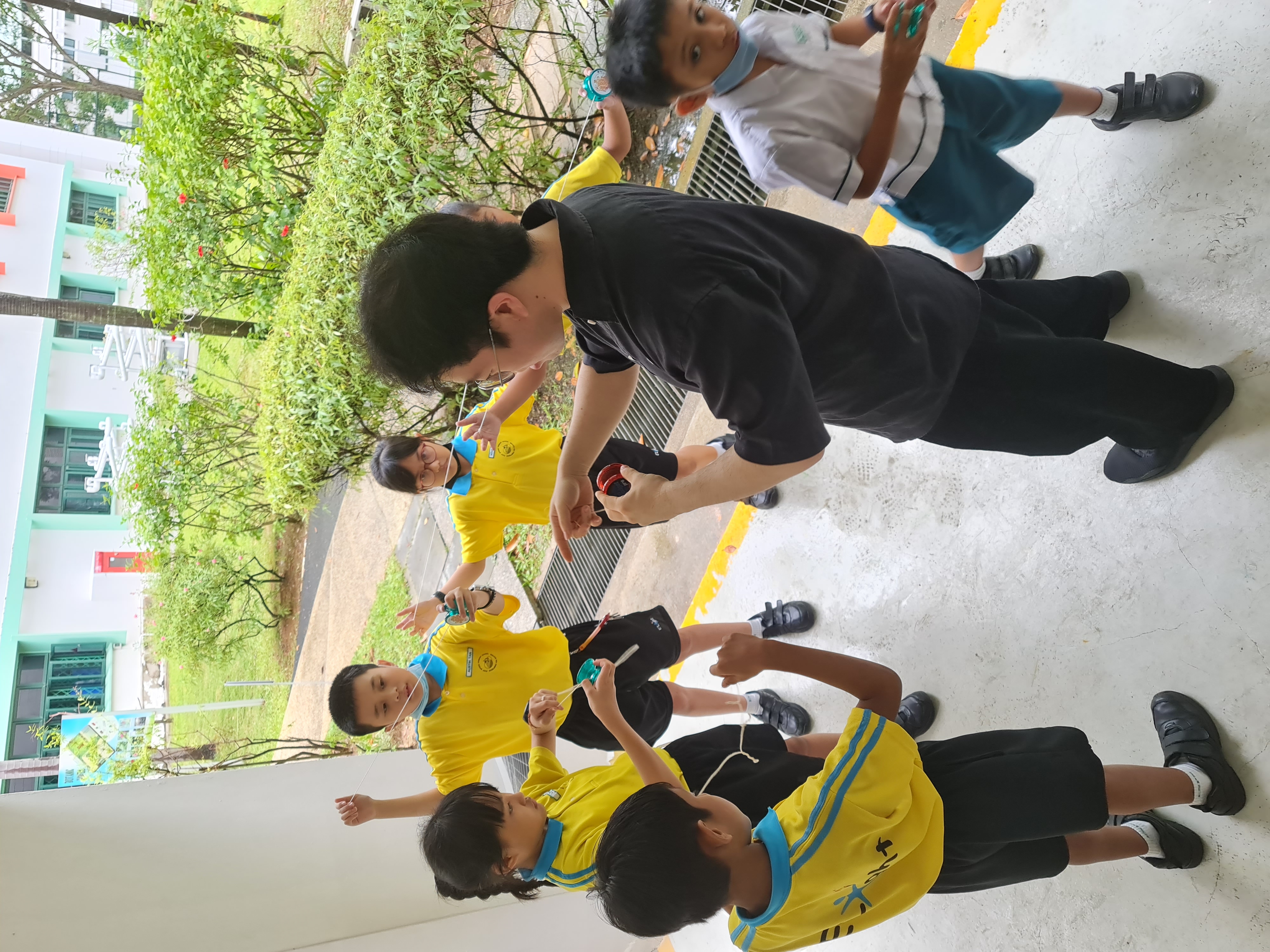 Yoyo instructor teaching primary school students