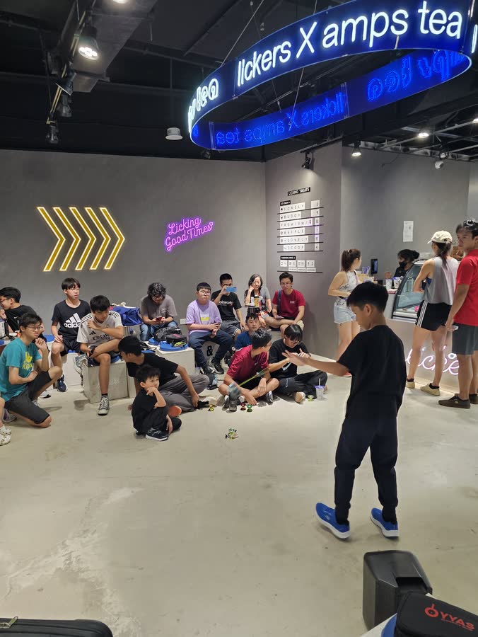 Workshop participants learning yoyo